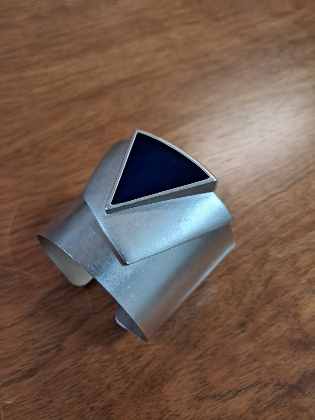 Bracelet with Silver colored metal and blue triangle